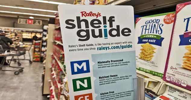 Nutrition shelf guide in aisle of store